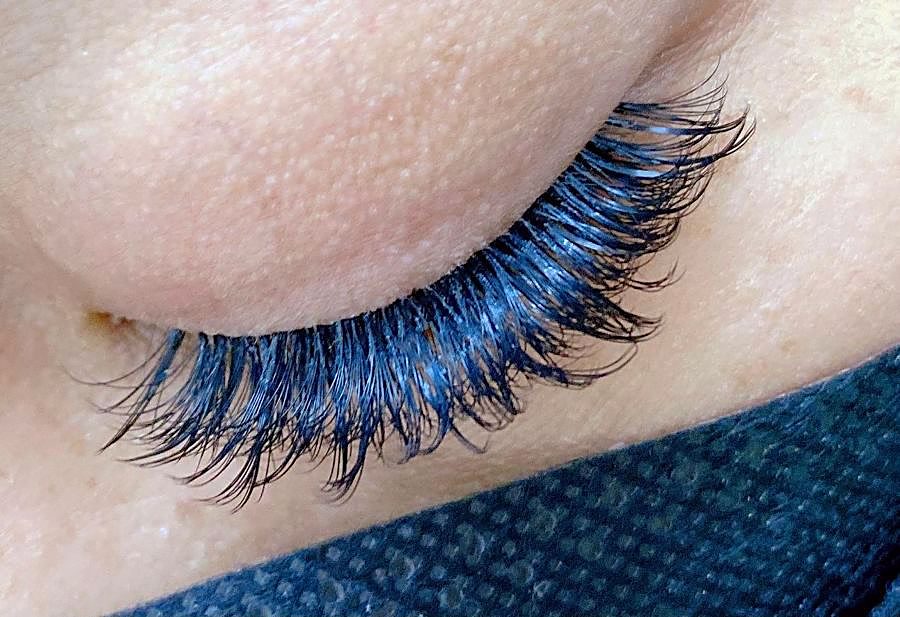 Blue-tinted volume lashes on a closed eye – Ellie Beauty, Singapore