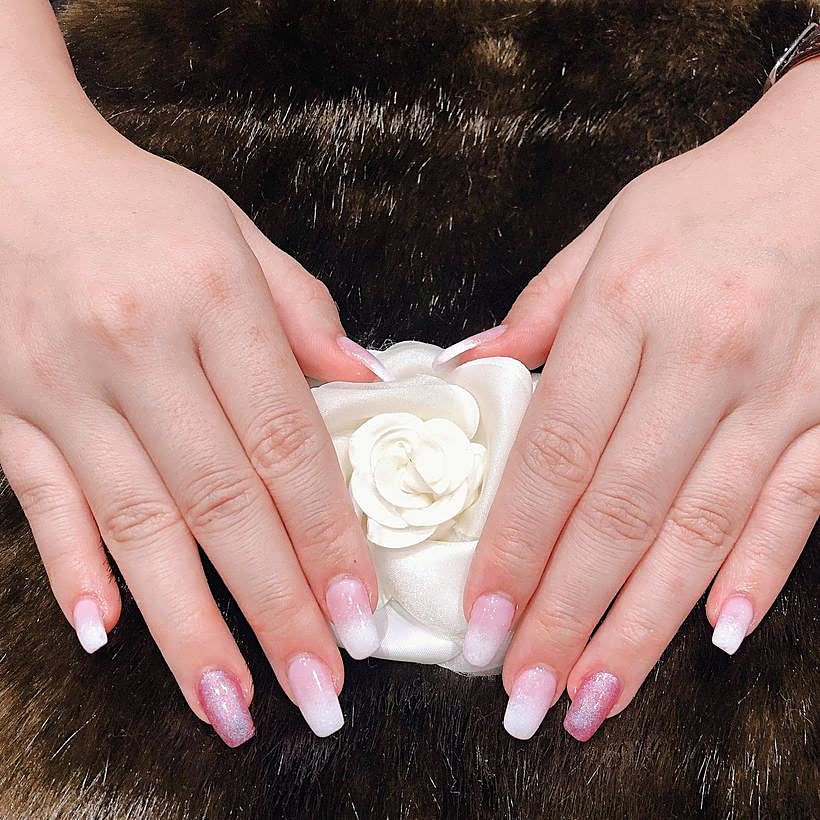Pink ombre gel nails on a fur background – Ellie Beauty, Singapore